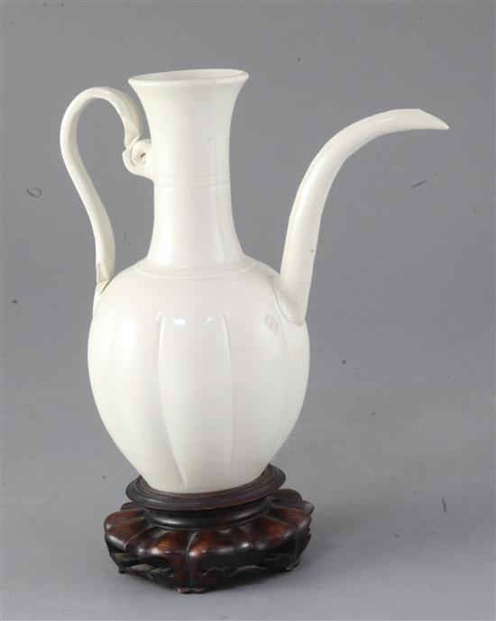 A Chinese white glazed ewer, Liao dynasty or later, 20cm high, repairs